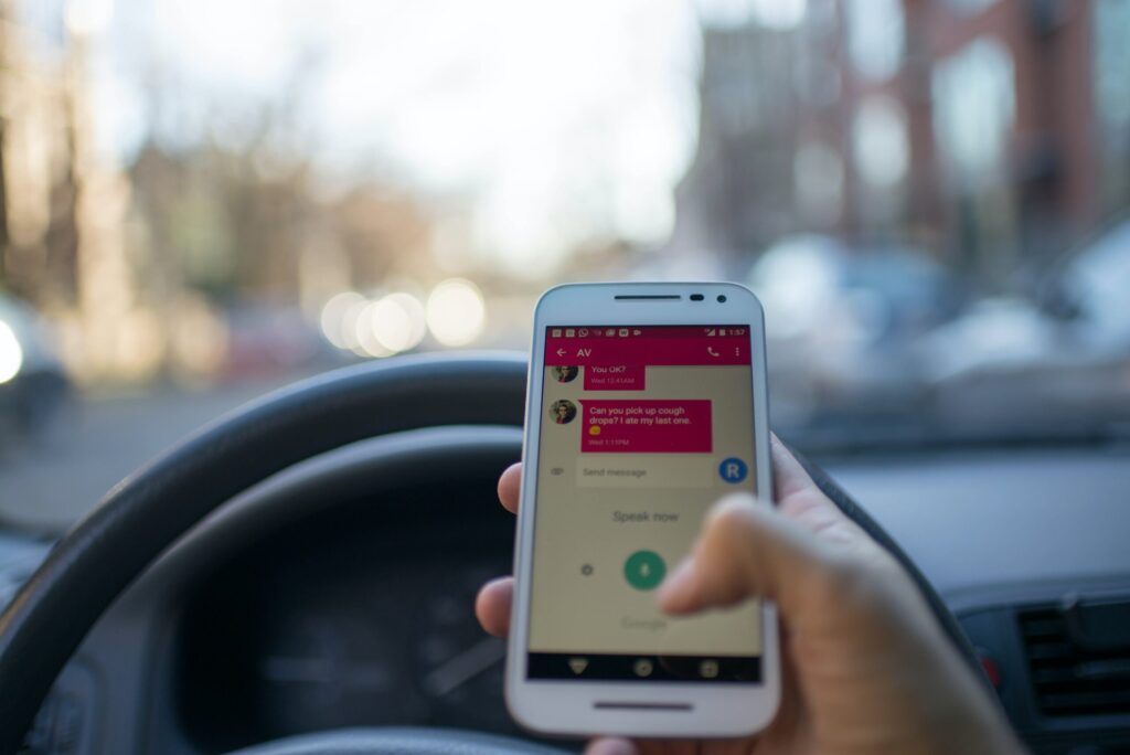 person driving with phone