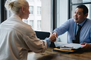 employer and employee shaking hands