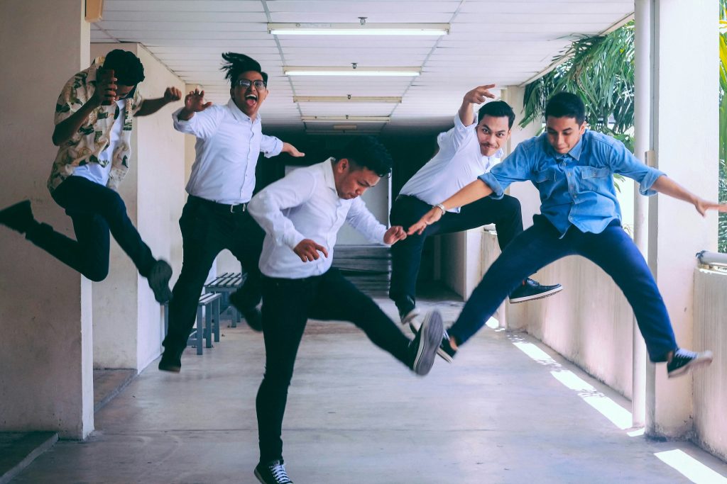 employees jumping off the ground